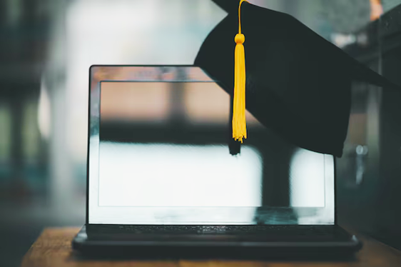 Laptop with graduation cap linking to page listing affiliated online stores